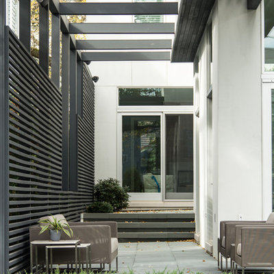 Trendy patio photo in Chicago with a pergola