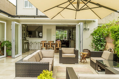 Design ideas for a classic patio in London with no cover and tiled flooring.