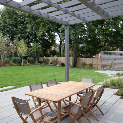 Example of a trendy patio design in Boston with a pergola