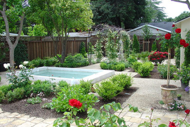 Inspiration for a mid-sized french country backyard gravel patio remodel in New Orleans