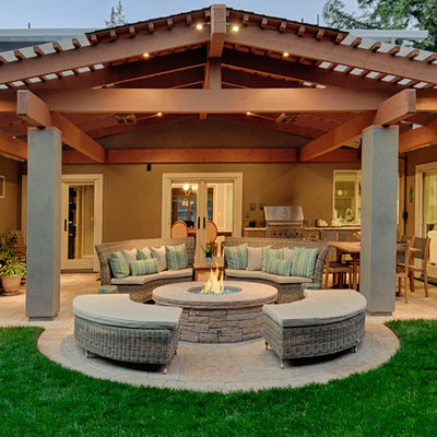 Example of a classic patio design in San Francisco with a fire pit