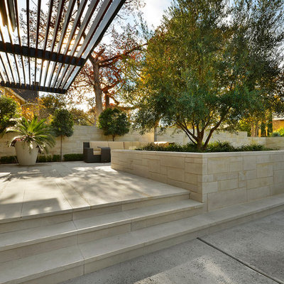 Inspiration for a contemporary patio remodel in Austin with a pergola