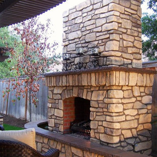 Inspiration for a large mediterranean backyard stone patio remodel in Other with a pergola and a fire pit