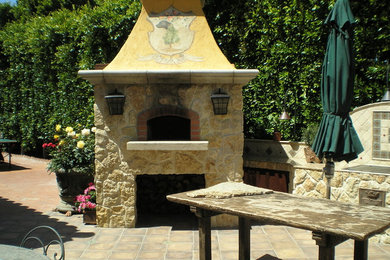 Patio - large transitional backyard tile patio idea in San Diego with a fire pit and a pergola