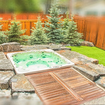 Maintenance-Free Backyard Featuring Sunken Hot Tub