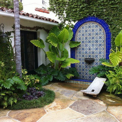 Inspiration for a mediterranean patio fountain remodel in Santa Barbara