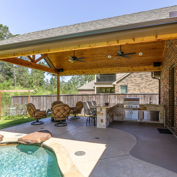 Majestic Patio Cover and outdoor kitchen with peninsula