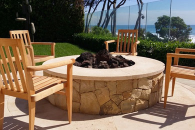 Inspiration for a small coastal backyard concrete paver patio remodel in San Diego with a fire pit and no cover