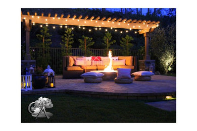 Design ideas for a medium sized classic back patio in Orange County with a fire feature, concrete paving and a pergola.