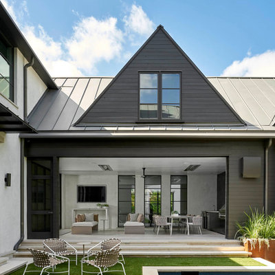 Patio kitchen - large contemporary courtyard concrete paver patio kitchen idea in Dallas with no cover