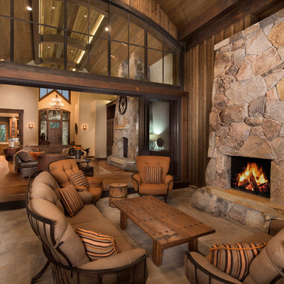 Mountain style patio photo in Sacramento with a roof extension and a fireplace