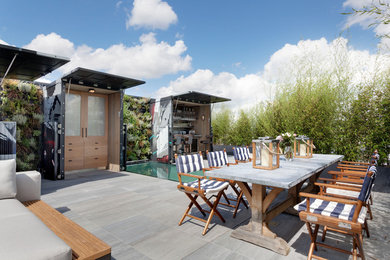 This is an example of an industrial patio in London with a bar area.