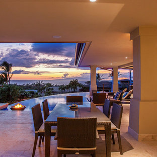 Example of an island style patio kitchen design in Hawaii