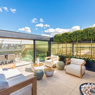 Photo of a small contemporary courtyard patio in London with no cover.