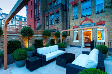 This is an example of a contemporary patio in London.