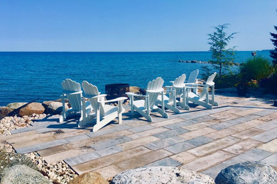 Example of a beach style patio design in Toronto