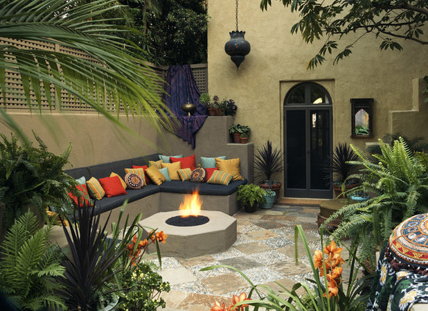 Mediterranean Courtyard by Tommy Chambers Interiors, Inc.
