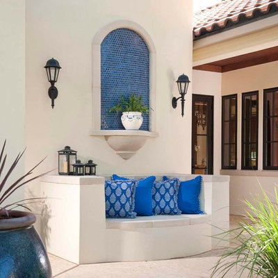 Tuscan courtyard patio photo in Dallas