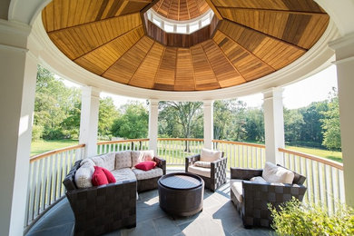 Inspiration for a large timeless front yard tile patio remodel in New York with a gazebo