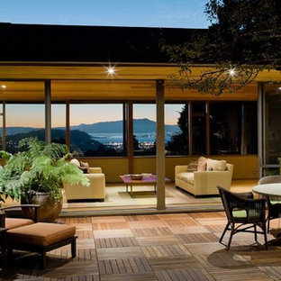 Patio - large contemporary courtyard patio idea in San Francisco with decking and no cover