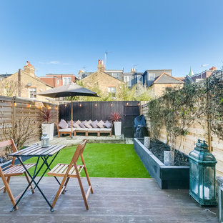 Design ideas for a medium sized contemporary back patio in London with no cover.