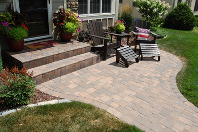 Inspiration for a timeless concrete paver patio remodel in Minneapolis