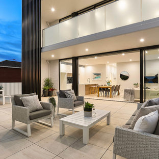 Design ideas for a modern patio in Sydney with no cover and concrete pavers.