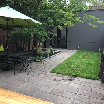 Modern Backyard Patio with Cedar Deck and Stone Patio in Toronto