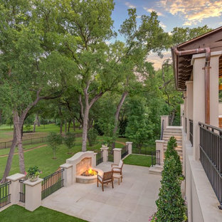 Patio - mediterranean patio idea in Dallas with a fire pit