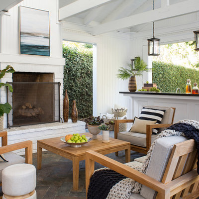 Patio - mid-sized transitional stone patio idea in Los Angeles with a roof extension