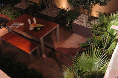 Example of a minimalist patio design in Charlotte