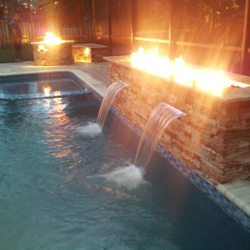 Modern custom Pool Fire Feature with Water cascades