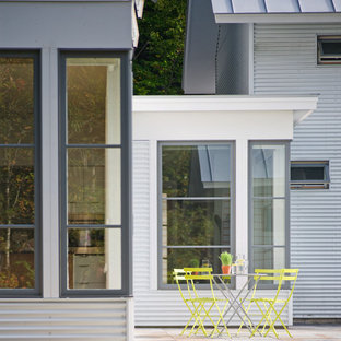 Example of a mid-sized cottage backyard patio design in Burlington with no cover