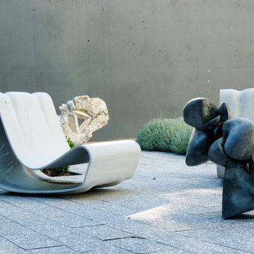 Modern Landscape Design Idea: Interior Courtyard with Willy Guhl Loop Chair
