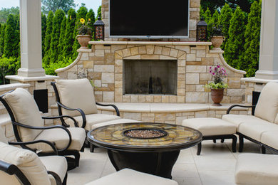 This is an example of a mediterranean patio in New York with a pergola and a fireplace.