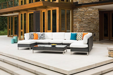 Inspiration for a large modern backyard concrete patio remodel in Other with no cover