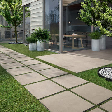Modern patio with cement look porcelain tile walkway