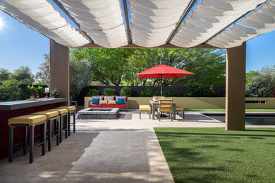 This is an example of a large modern back patio in Phoenix with a fire feature, tiled flooring and a gazebo.