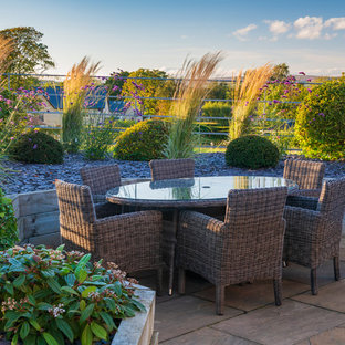 Traditional patio in Other with tiled flooring and no cover.