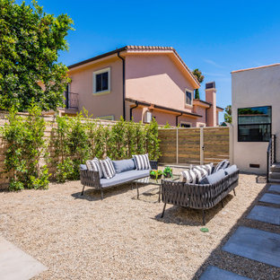 Patio - mediterranean gravel patio idea in Los Angeles with no cover