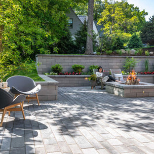 Patio - transitional backyard concrete paver patio idea in Other with a fire pit and no cover
