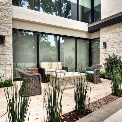 Patio - mid-sized contemporary concrete paver patio idea with no cover