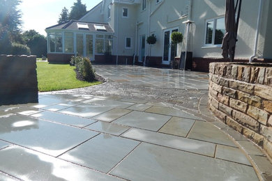 Photo of a large traditional patio in Cheshire.