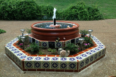 Inspiration for a mid-sized mediterranean backyard concrete patio fountain remodel in Nashville with no cover