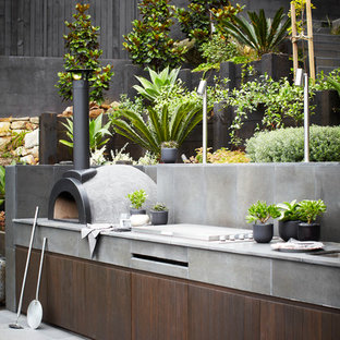 Inspiration for a huge contemporary backyard patio kitchen remodel in Sydney with no cover