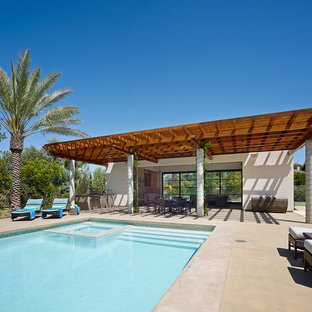 Inspiration for a contemporary backyard concrete patio remodel in San Francisco with a pergola