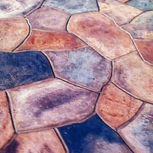Immagine di un patio o portico tradizionale dietro casa con cemento stampato