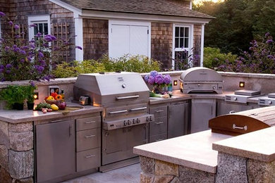 Mid-sized elegant backyard concrete patio kitchen photo in Other with no cover