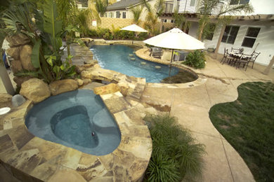 Inspiration for a mid-sized contemporary backyard stamped concrete pool remodel in San Francisco