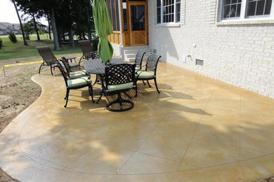 Patio - small transitional side yard stamped concrete patio idea in Nashville with no cover